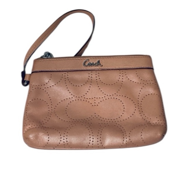Coach Handbags - 🐳 Coach Peach Perforated Wristlet